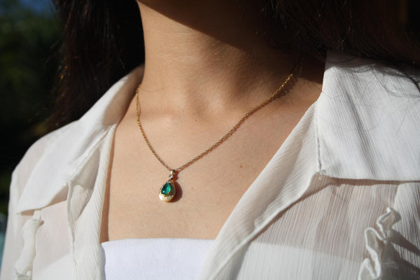 Emerald Halo Pendant Necklace in 18k Yellow Gold