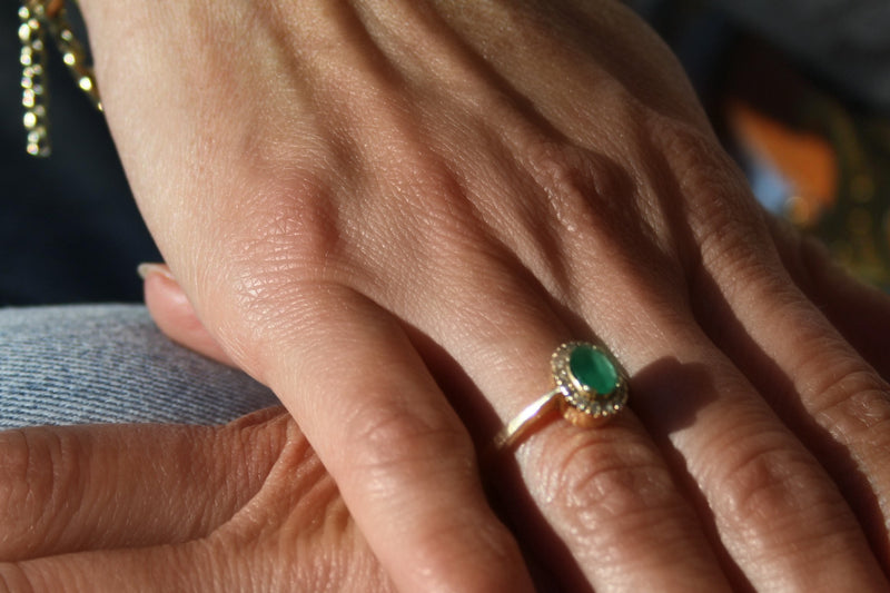 Oval Colombian Emerald Halo Ring in 18k Gold